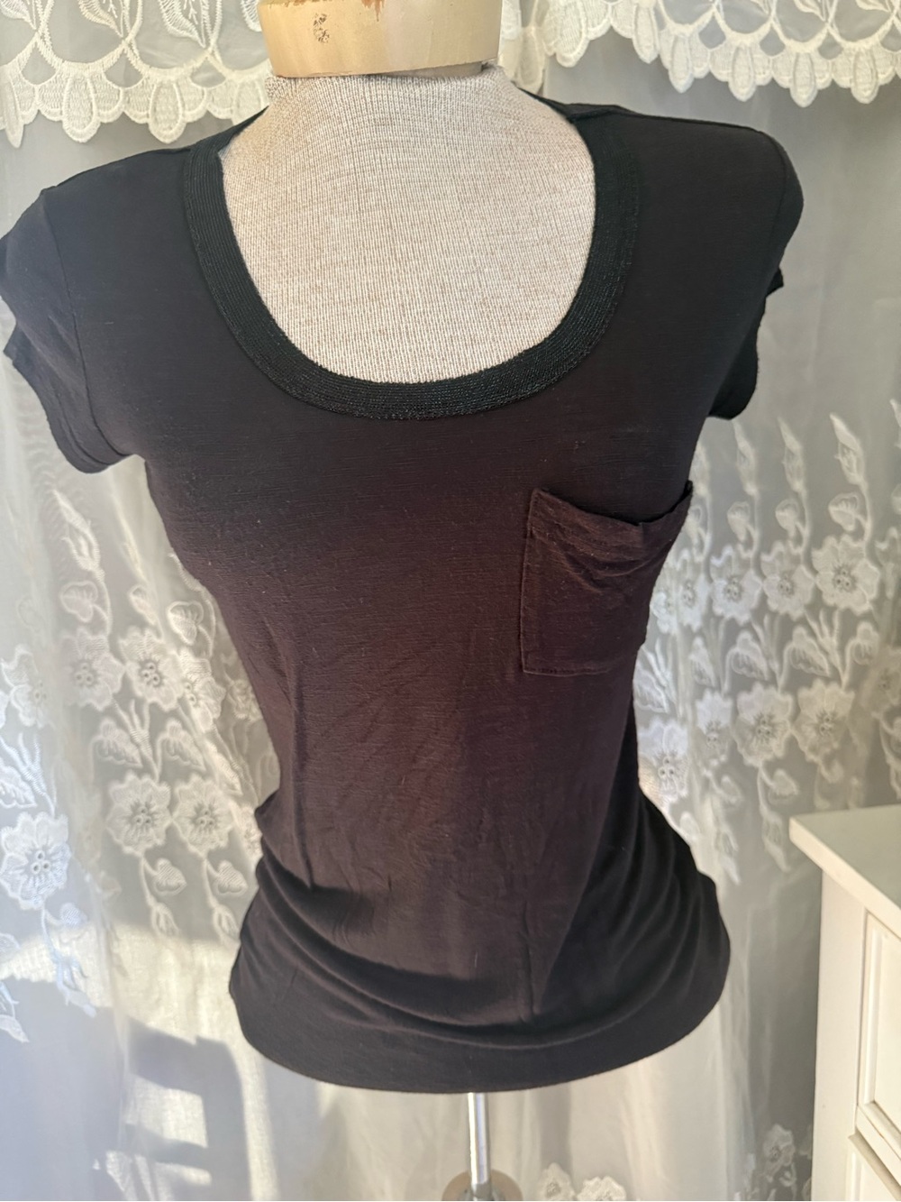 Calvien Klein women’s  Black Scoop Neck Pocket Tee.